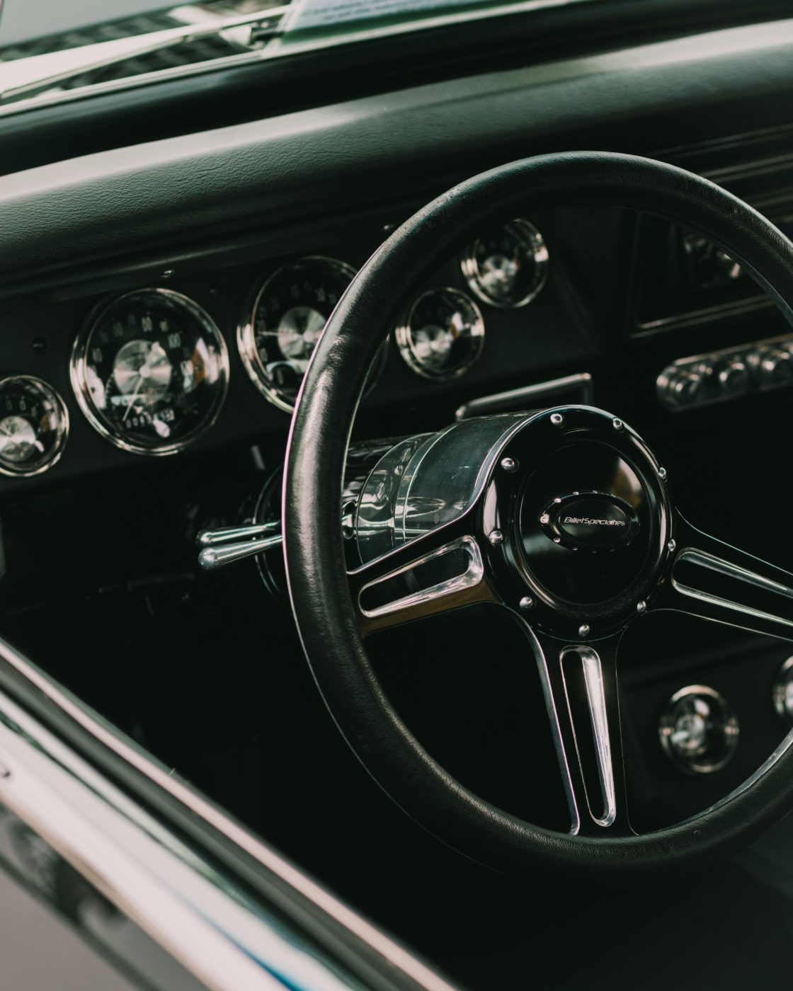 Detailed classic car interior - steering wheel and gauges