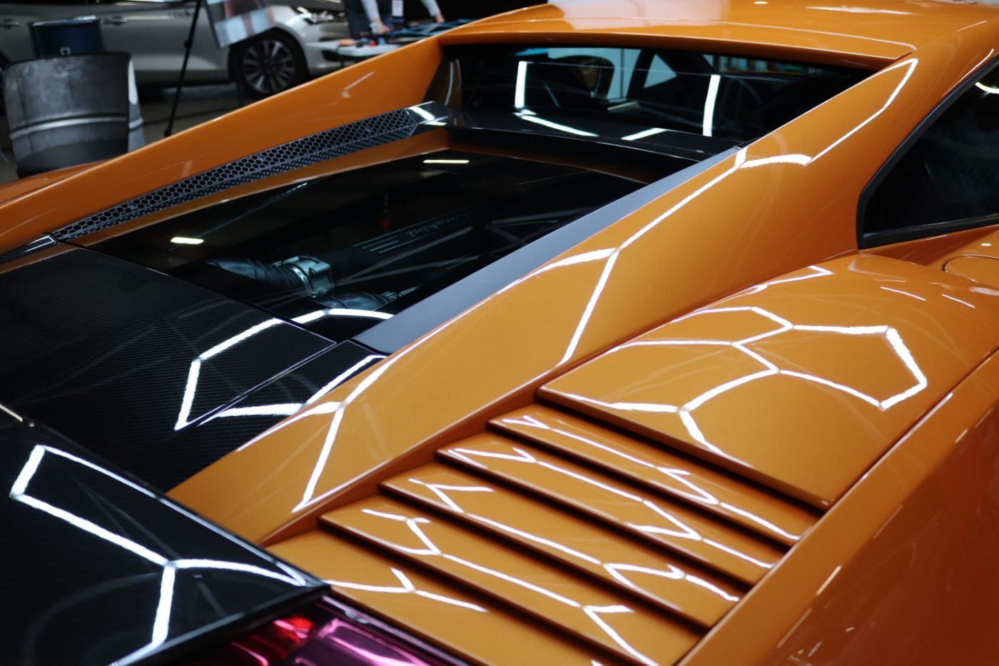 Deep, mirror-like gloss on a ceramic-coated supercar rear