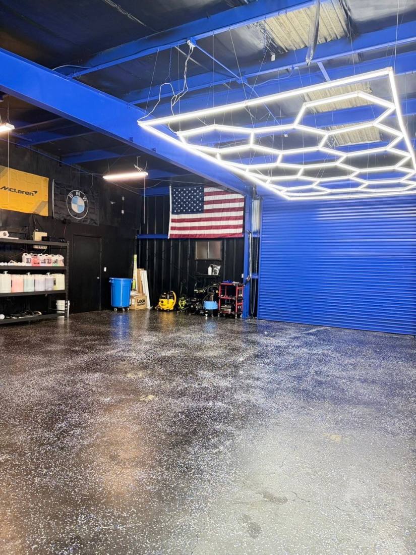 Wash bay with the roll-up door and flag